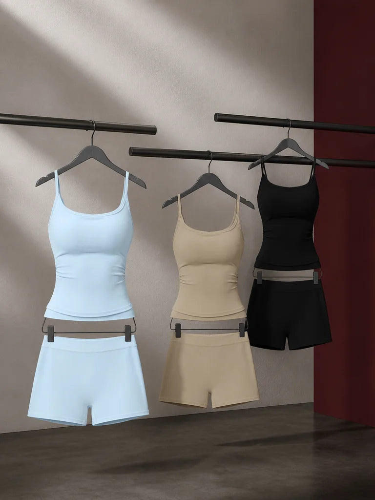 Campaign portrait of three distinct sourced color variants of the same activewear set—light blue, cr