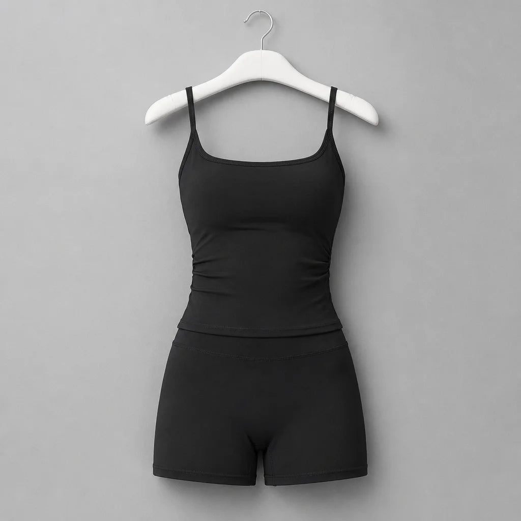 Clean isolated fashion product photograph, 1:1. The exact referenced black sleeveless sports bra and